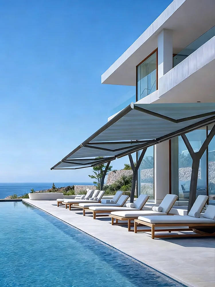 Motorized retractable awning protecting a hospitality terrace beside a swimming pool