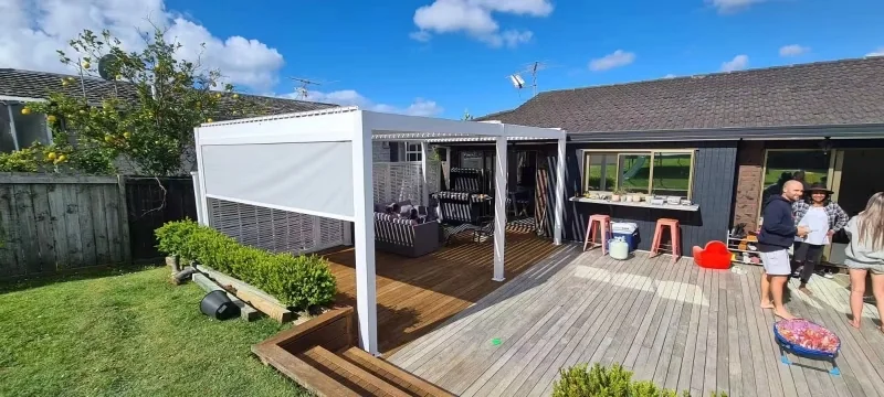 Retractable aluminum pergola over a large outdoor deck