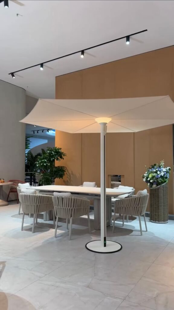 Large square Milan patio umbrella with built-in LED light, aluminum center pole and freestanding base