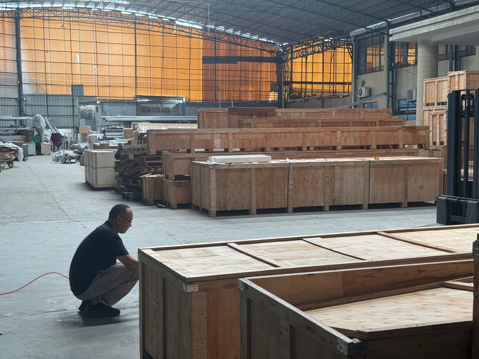 Large wooden export crates prepared inside the LINGYUE factory