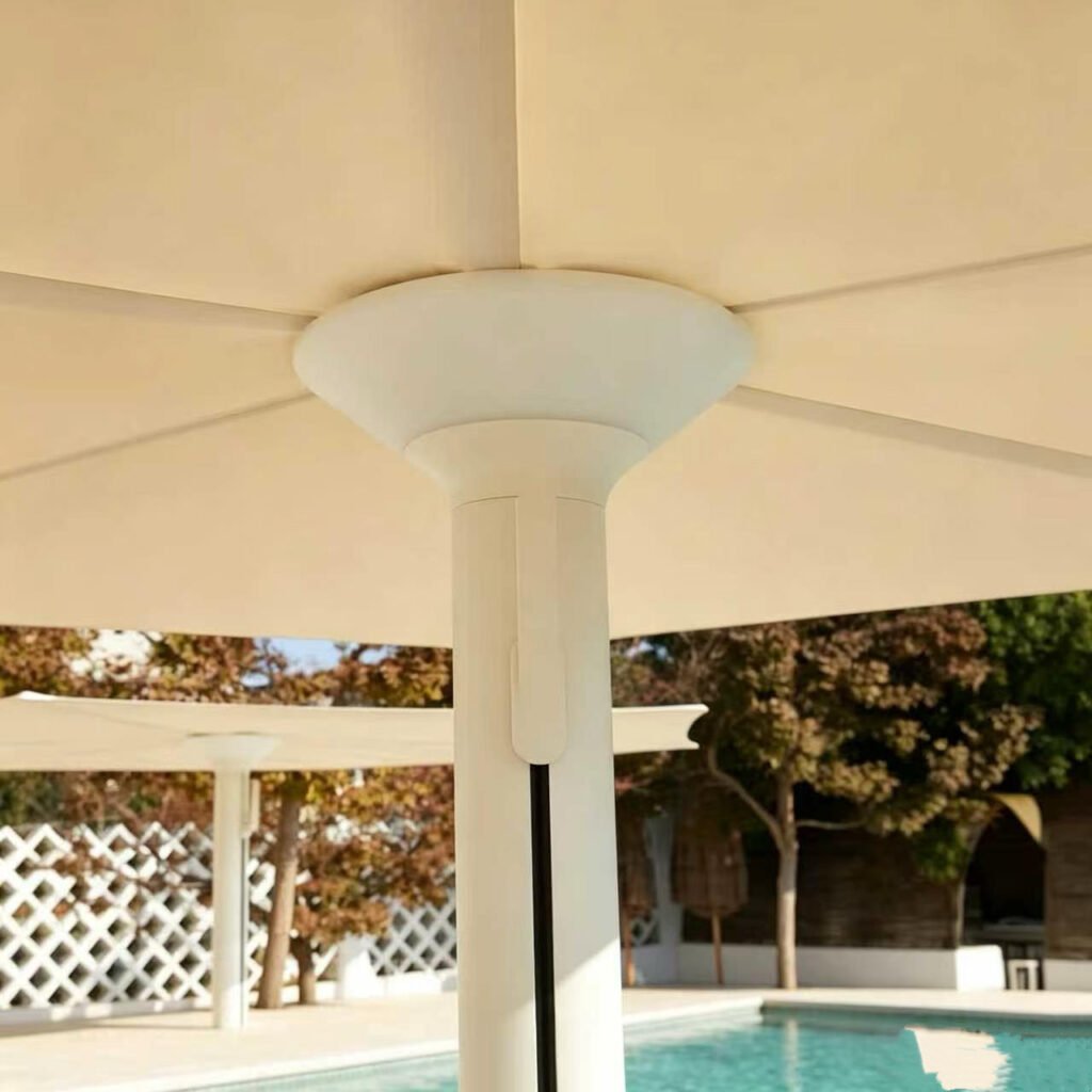 Close-up of a Milan patio umbrella center hub with integrated LED lighting and a white aluminum support pole