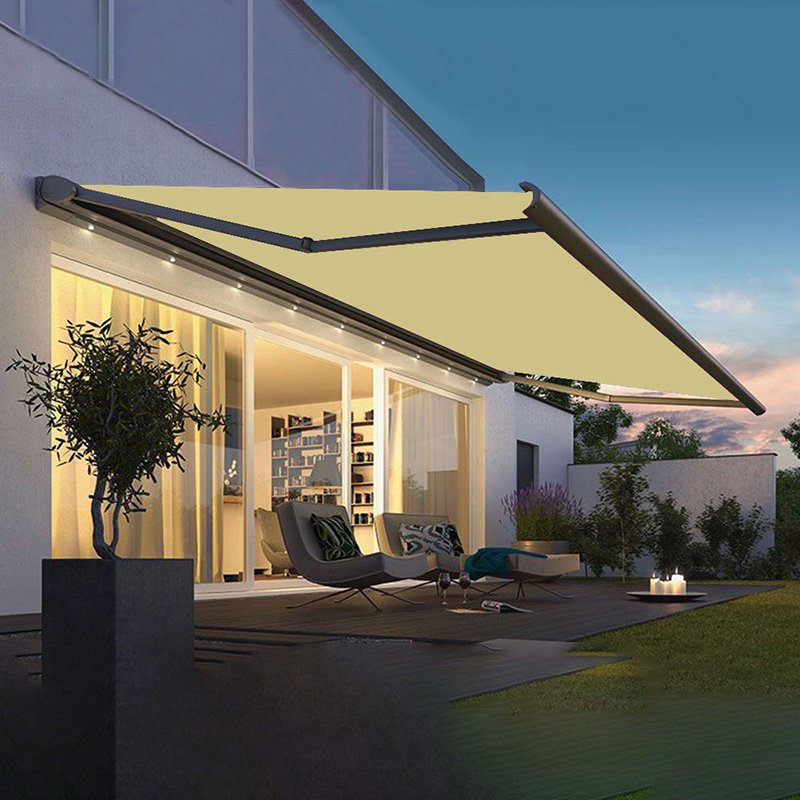 Wall-mounted motorized retractable folding arm awning with integrated LED lighting and a cream fabric canopy over a residential patio
